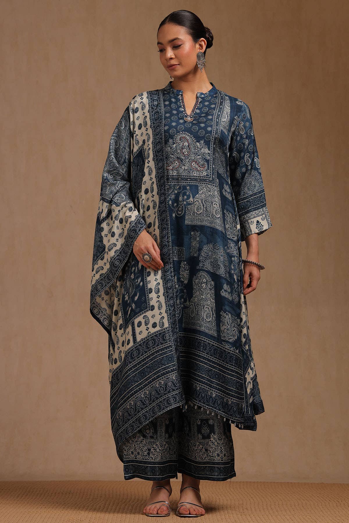 Indigo Dola Silk Ethnic Motifs Thread Work A-Line Palazzo Suit Set Dola Silk · Ethnic Motifs · Thread Work · A-Line · Mandarin Neck · Palazzo